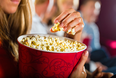 Woman-container-popcorn-cinema-movie-theater